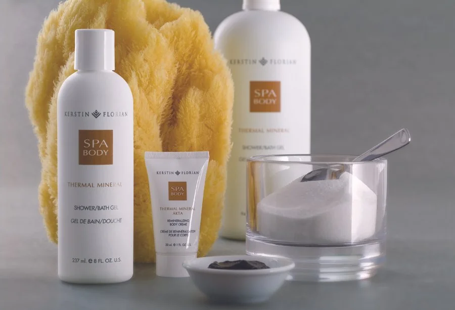 Kerstin Florian bath and body packaging photographed with towels and spa accessories